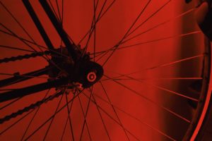 Wheel spokes set against a red background