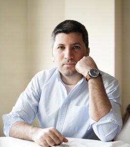 A photo of Siavash Saadlou. He is wearing a light blue shirt and watch.